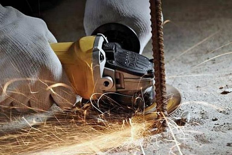 Cutting metal with an angle grinder.